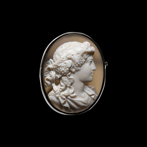 A silver brooch set with a large Neoclassical agate cameo. Bust of Maenad.